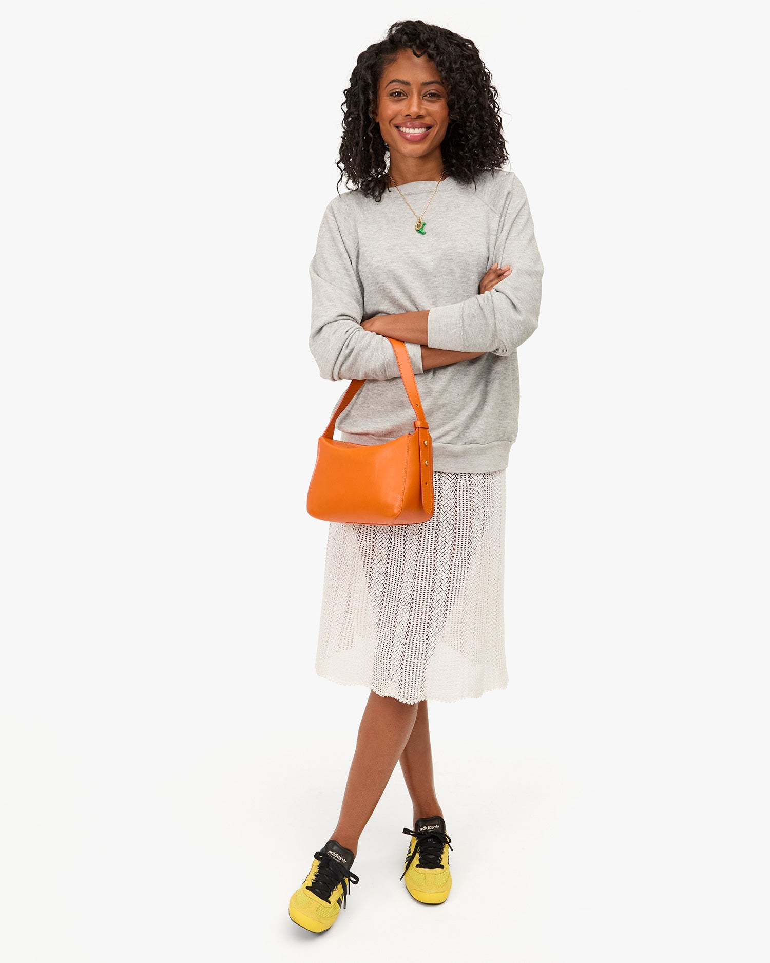 Model carrying the Zucca (orange) Fleurine on her arm. 