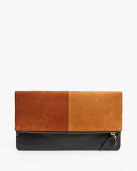 the Suede & Nappa Patchwork Foldover Clutch with Tabs foldoved over