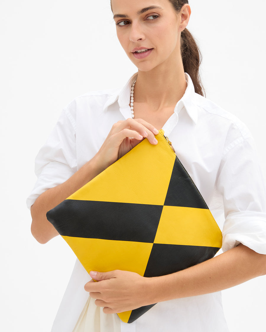 Marie holding Foldover Clutch w Tabs