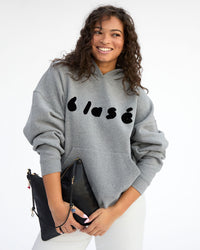 Jade holding Foldover Clutch