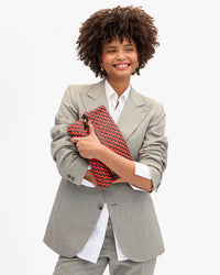 Lenny holding Foldover Clutch w Tabs