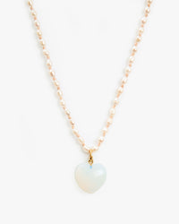 Opal Mylar Stone Heart Charm on the freshwater pearl necklace