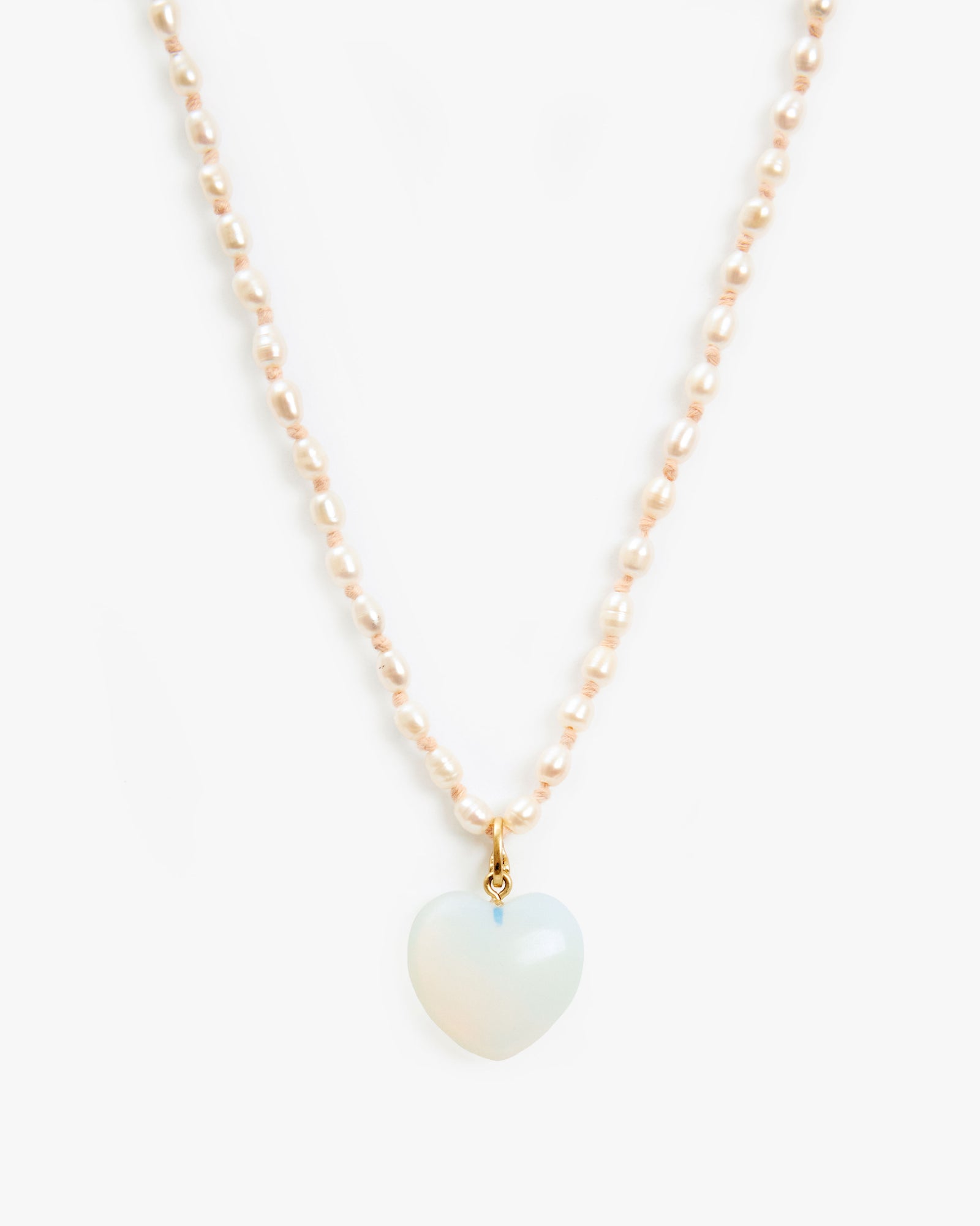 Opal Mylar Stone Heart Charm on the freshwater pearl necklace