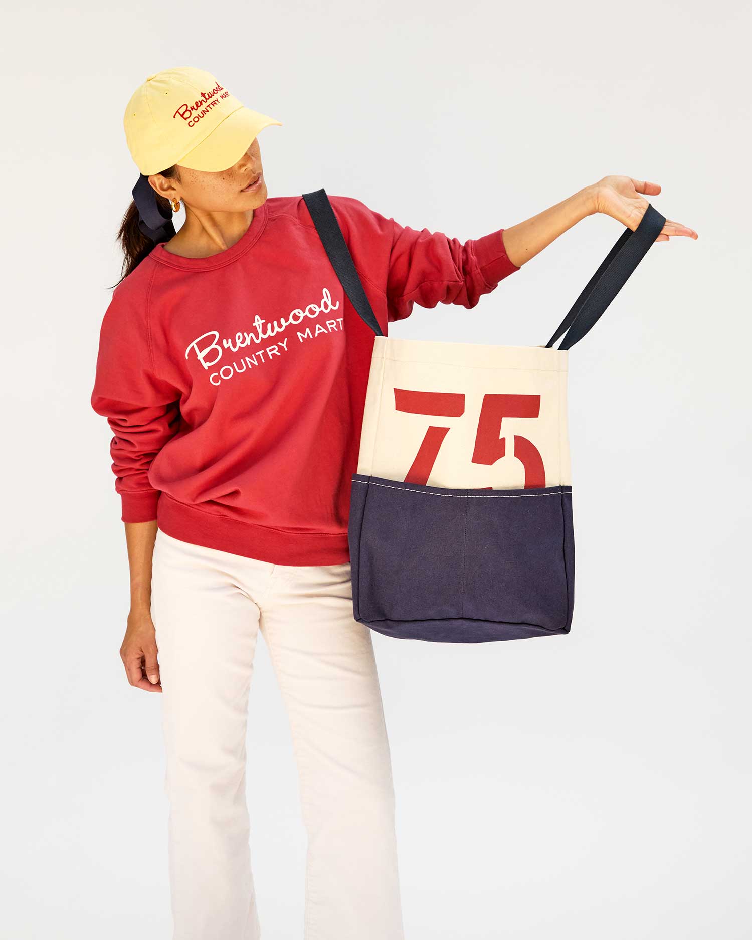 Maly in white jeans and the Brentwood Sweatshirt and Hat with the Natural & Navy Canvas w/ Brentwood Red 75 Giant Marine