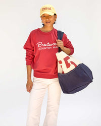 Maly with the Natural & Navy Canvas w/ Brentwood Red 75 Giant Marine on her left shoulder shoulder 