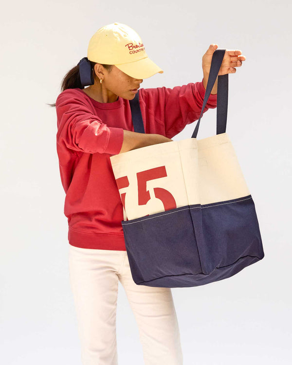 Maly reaching for something inside the Natural & Navy Canvas w/ Brentwood Red 75 Giant Marine 