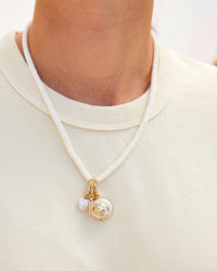 Gold Dipped Shell Charm  Shown on the Stacked Shell Necklace with the Sardine Charm, and the Gold Dipped Shell Charm