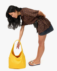 Sandra reaching into Grand Bando