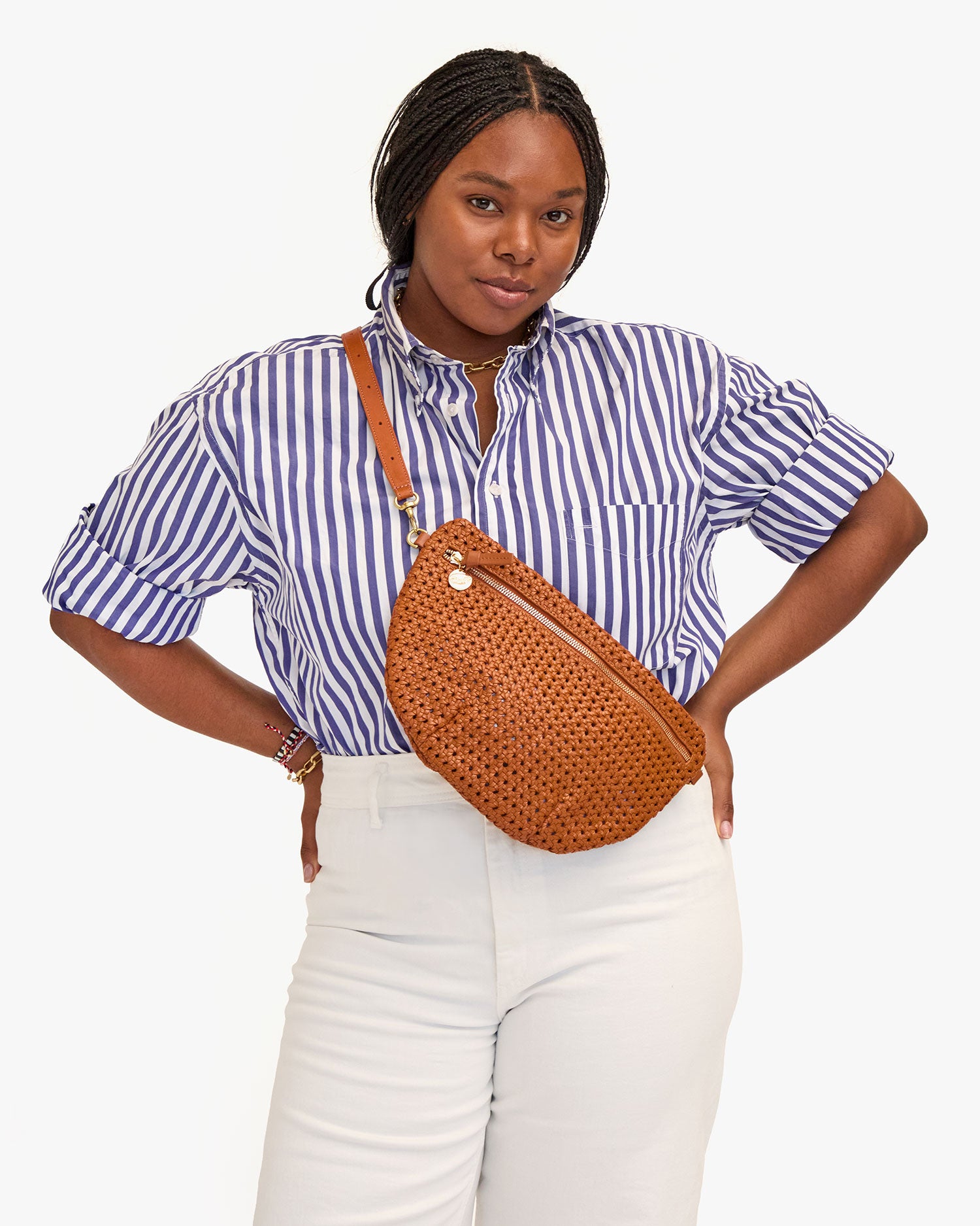 Candace wears the Tan Rattan Grande Fanny as a crossbody