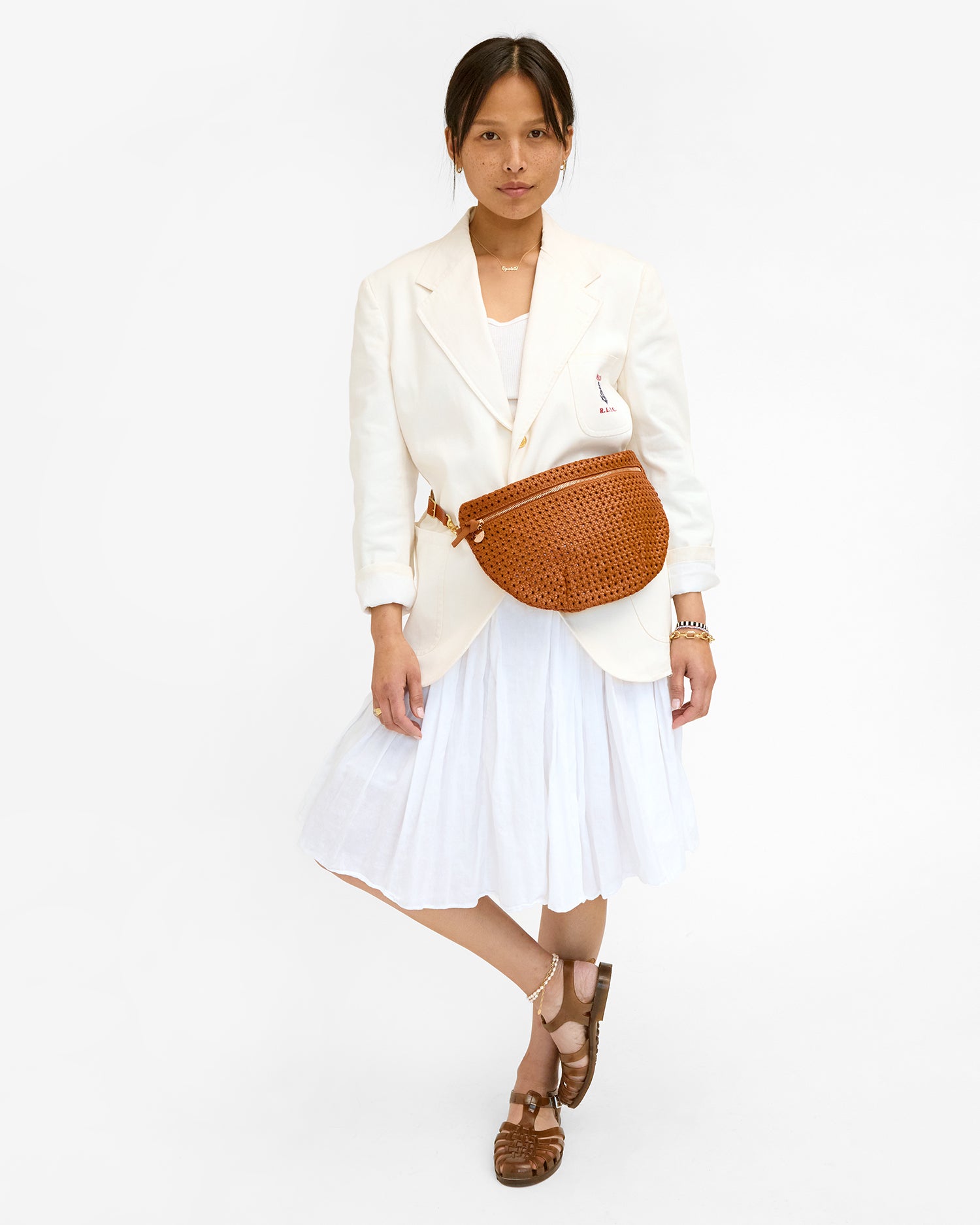 Maly wears the Tan Rattan Grande Fanny as a belt bag