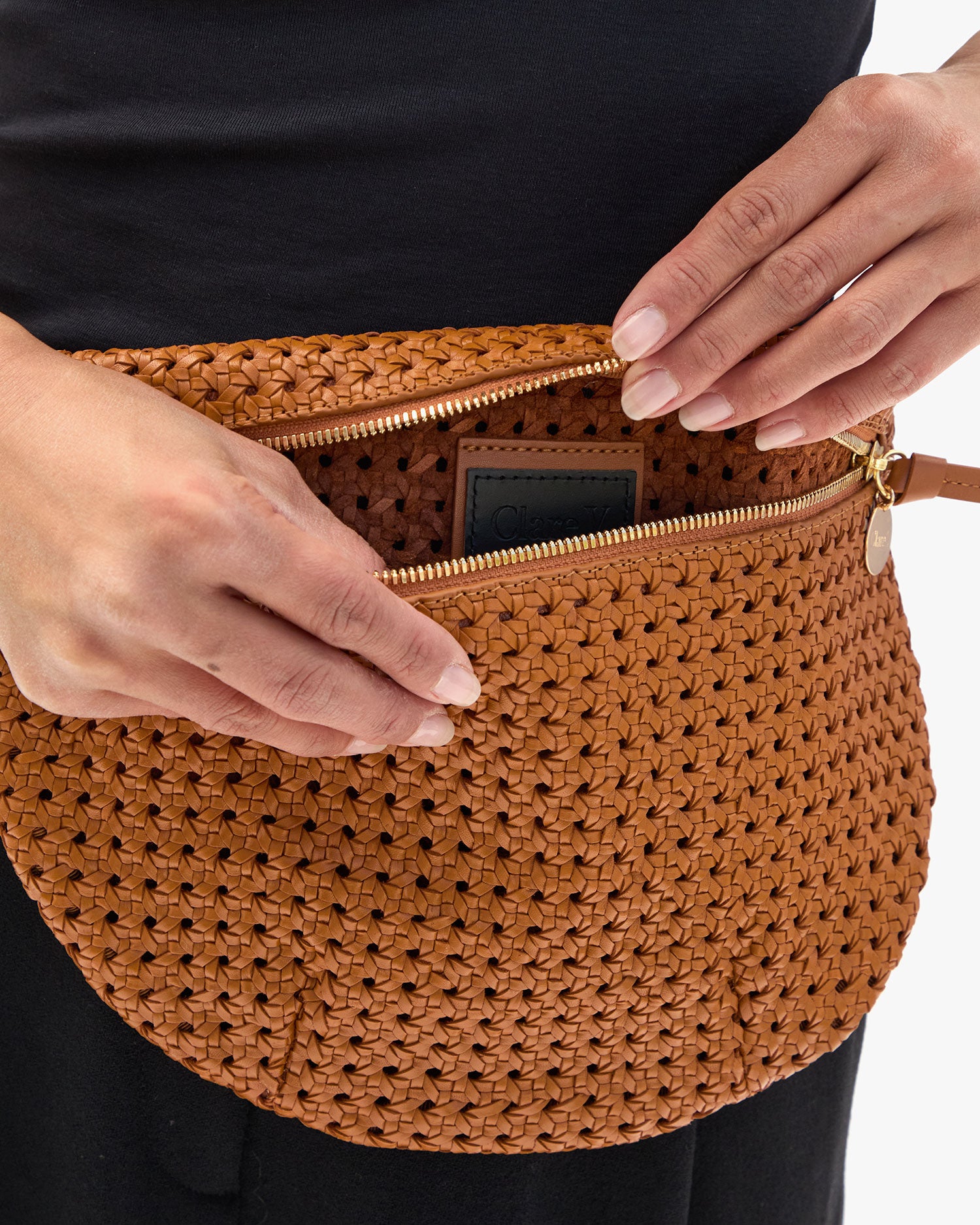Model showing the inside of our unlined Tan Rattan Grande Fanny.