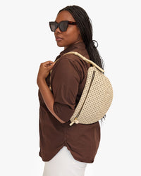 Candice wearing the Cream Rattan Grande Fanny as a Shoulder Bag