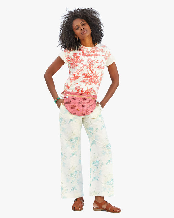 Mecca wearing the Classic Tee in Cream w/ Bright Poppy St. Calais Toile with the unlined Petal Rattan Grande Fanny around her waist.