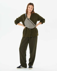 Zoe wearing the Black & Cream Woven Zig Zag Grande Fanny across her chest