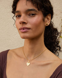Haro wearing the 14k Gold Vermeil Heart Charm on the rolo chain necklace