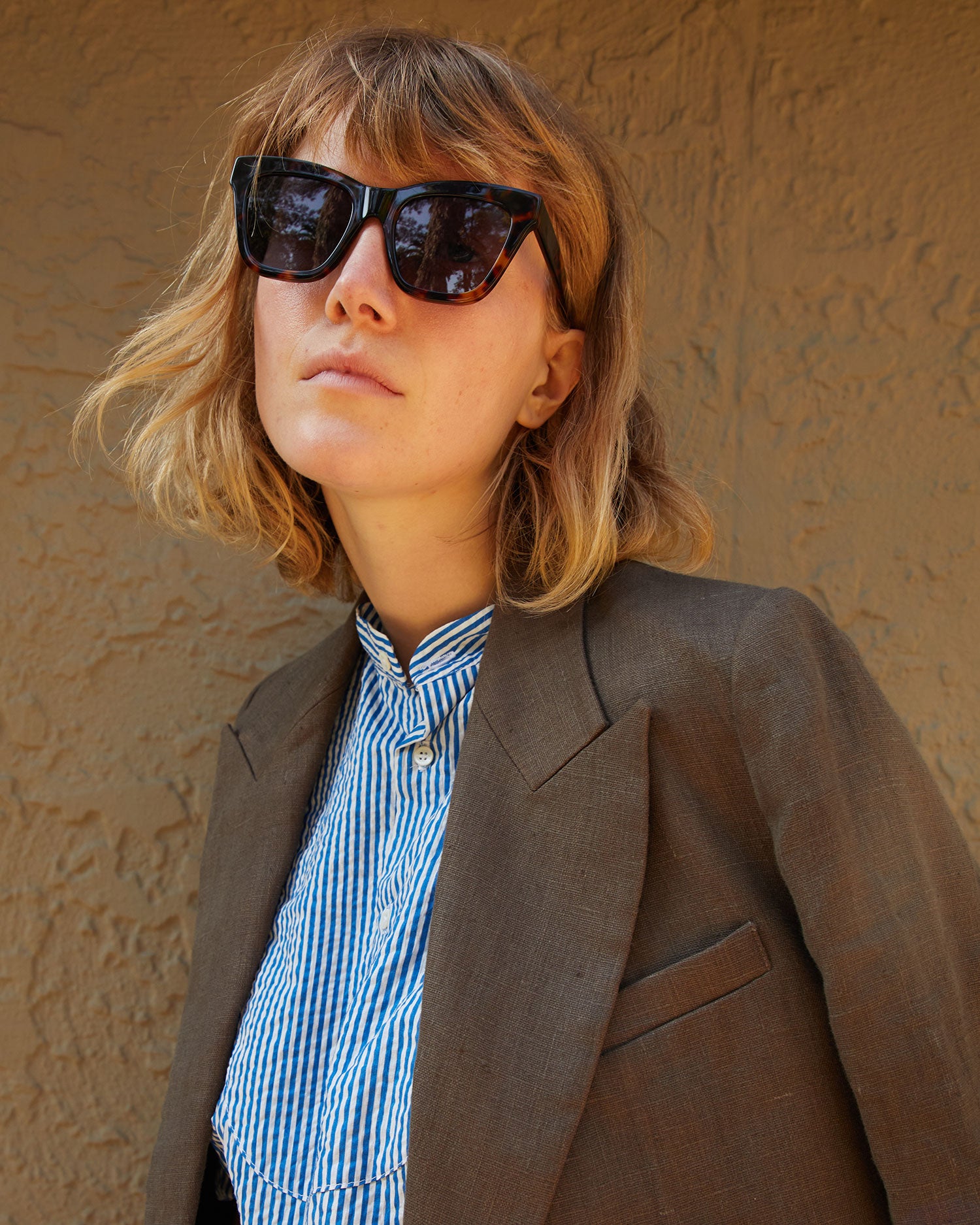 Lou wearing the Steven Alan Linen Blazer in Tobacco  with the CV Heather Sunglasses in Tortoise