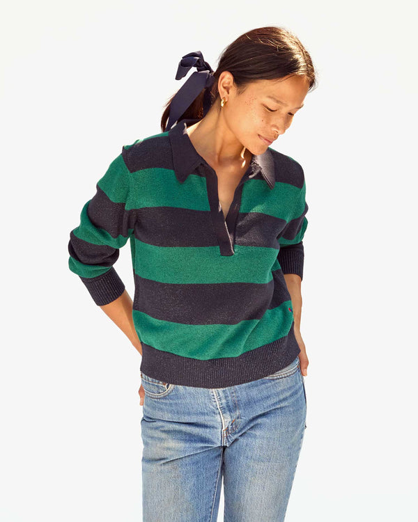 Maly wearing the Navy & Green Stripe Heloise Polo Sweater with jeans