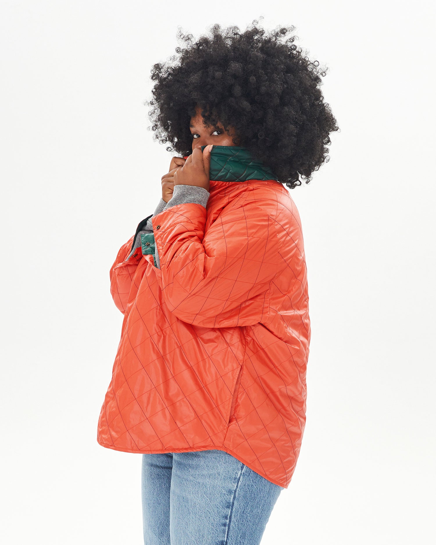 Candice hiding her face with the collar of the Spruce & Poppy Quilted Nylon Jacque Jacket