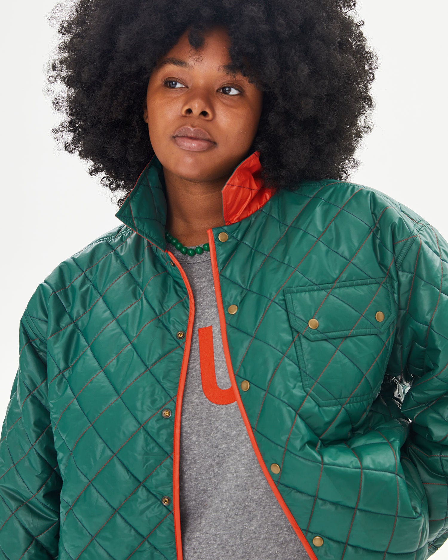 Candice with the collar of the Spruce & Poppy Quilted Nylon Jacque Jacket popped 