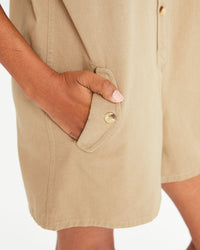 Mecca's hand in the pocket of the Khaki Jumpsuit Cargo