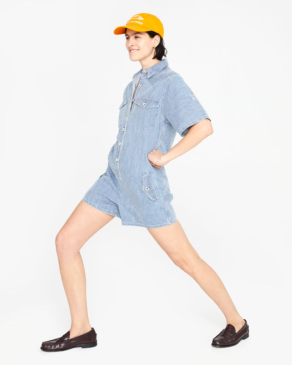 athena doing a lunge in the Engineer Stripe Jumpsuit Cargo 