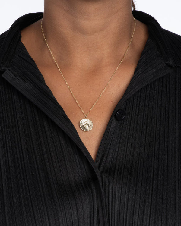 model wearing the Kathryn Bentley Urn Greek Coin Pendant Necklace