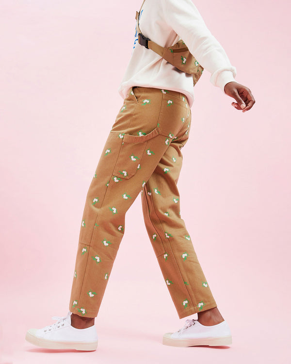 Model wearing the Khaki Cargo Pants with white sneakers and a white sweatshirt