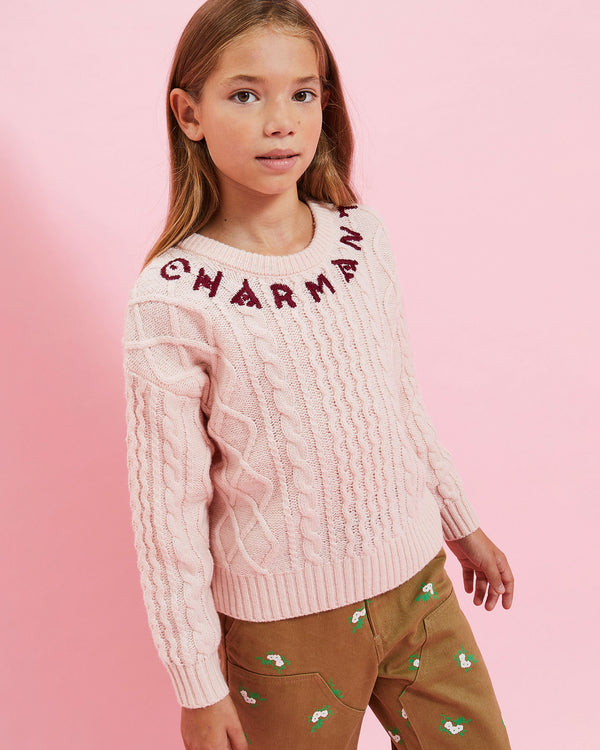 Model wearing the Petal w/ Oxblood Charmant Kids Fisherman Sweater with the khaki kids pants