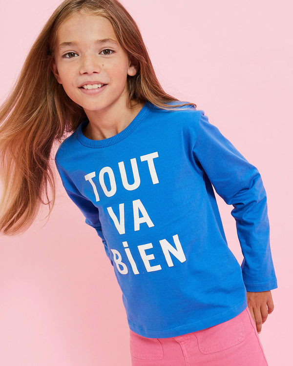 Model wearing the Cobalt w/ Cream Tout va Bien Kids Longsleeve Tee with pink pants