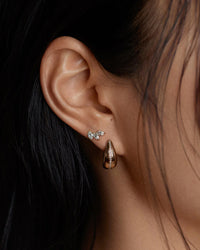 Model wearing the Kinn Studios Pavé Diamond Teardrop Hoops