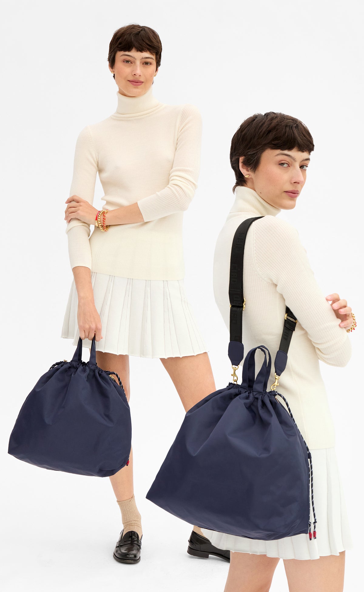 Model wearing a cream skirt with matching top and carrying the Navy Sac Tout. 
