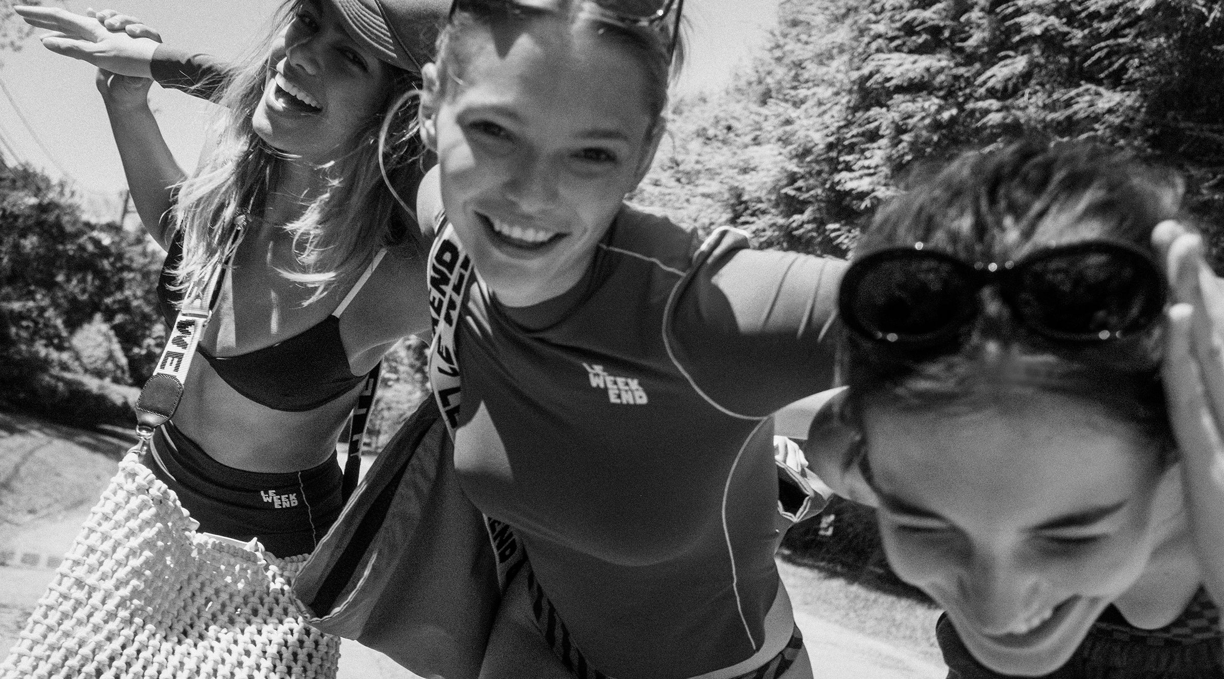Models in CV x Left On Friday swimwear smiling and posing for a picture. 