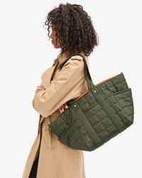 Le Box Tote Sportif on Mecca's shoulder