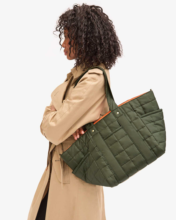Le Box Tote Sportif on Mecca's shoulder