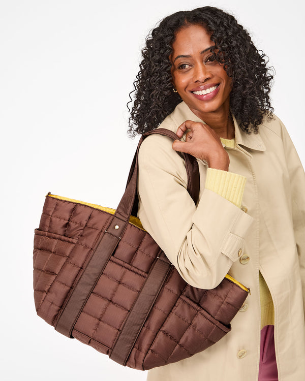 Le Box Tote Sportif on Mecca's shoulder