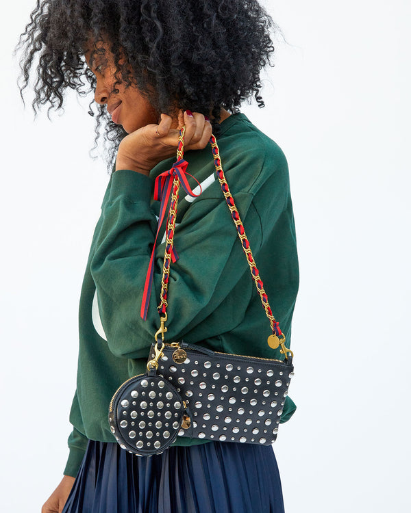 Mecca carrying the black with studs wallet clutch with tabs by the Navy/Red Grosgrain Chain Shoulder Strap