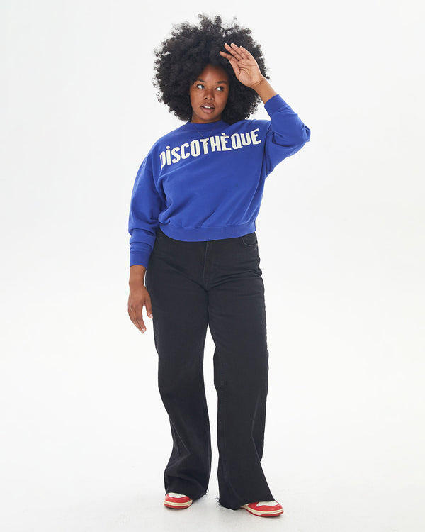 Candice wearing the Cobalt Discothèque Le Drop with black pants