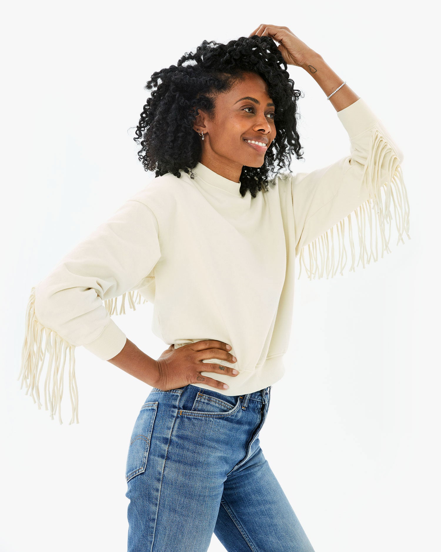 Mecca wearing the Cream Le Drop Fringe with jeans