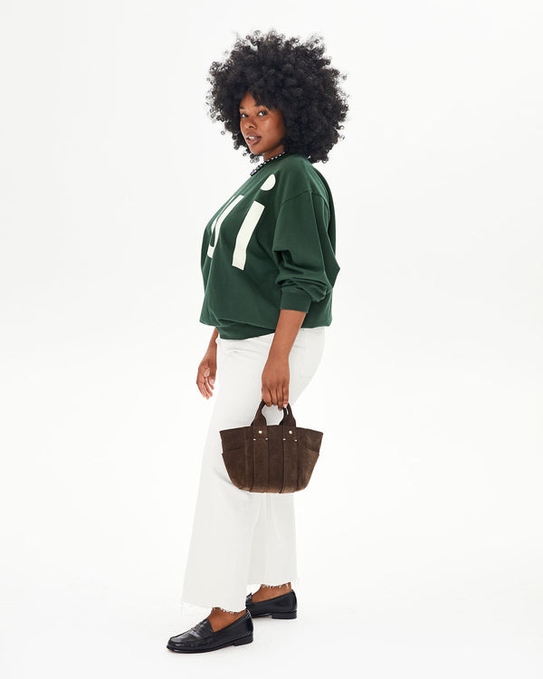 Candice holding the Chocolate Suede Le Petit Box Tote in her left hand