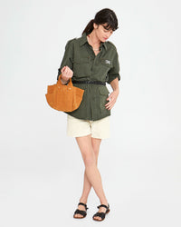 danica holding the Le Petit Box Tote in Camel Suede on her forearm