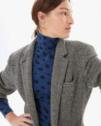 Zoe wearing the Faded Marine Jaguar Le Turtleneck with a blazer