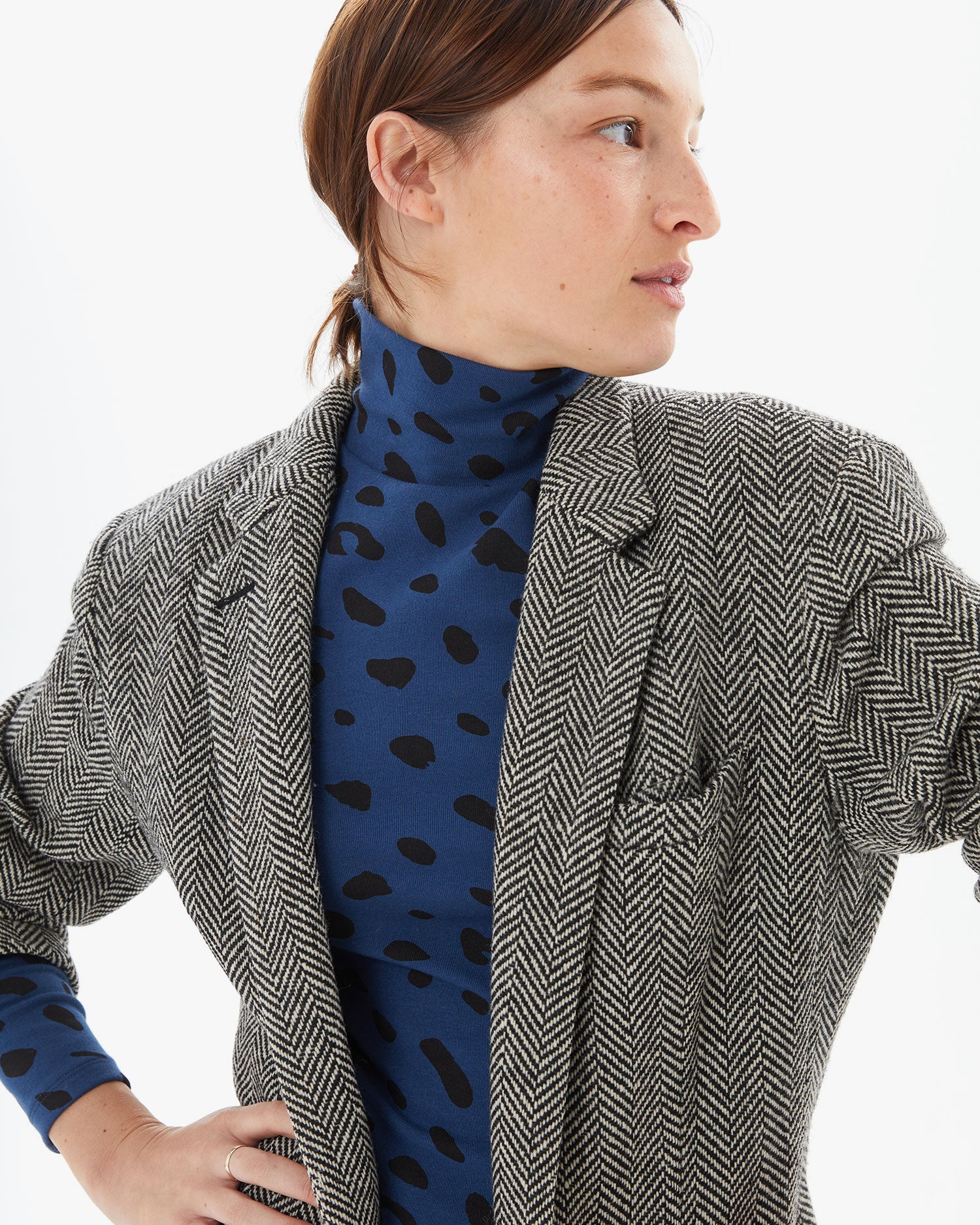 Zoe wearing the Faded Marine Jaguar Le Turtleneck with a blazer