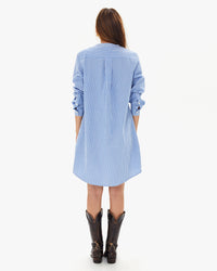 back view of aurelia in the Blue & Cream Stripe Le Tux Dress with cowboy boots