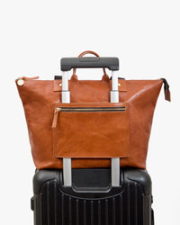 Le Zip Sac on a suitcase