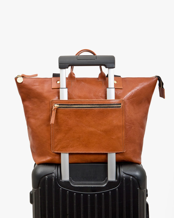 Le Zip Sac on a suitcase