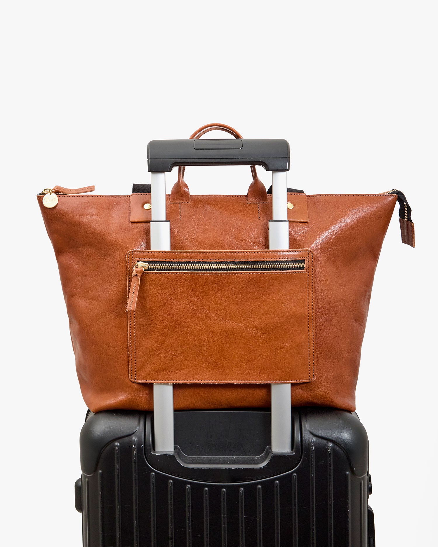 Le Zip Sac on a suitcase