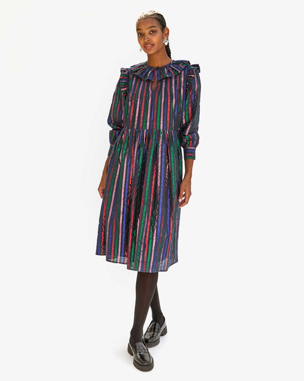 Jordan in the Multi Stripe Léonie Dress with black tights and shiny black loafers