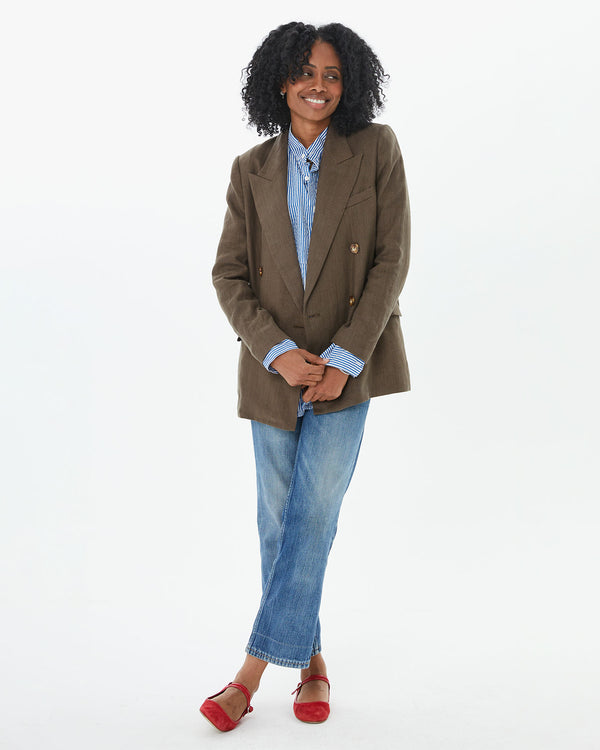 Mecca wearing jeans and red mary janes with the Steven Alan Linen Blazer in Tobacco  over the blue and cream stripe tux shirt