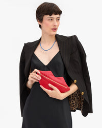 Lips Flat Clutch in Nike's hands