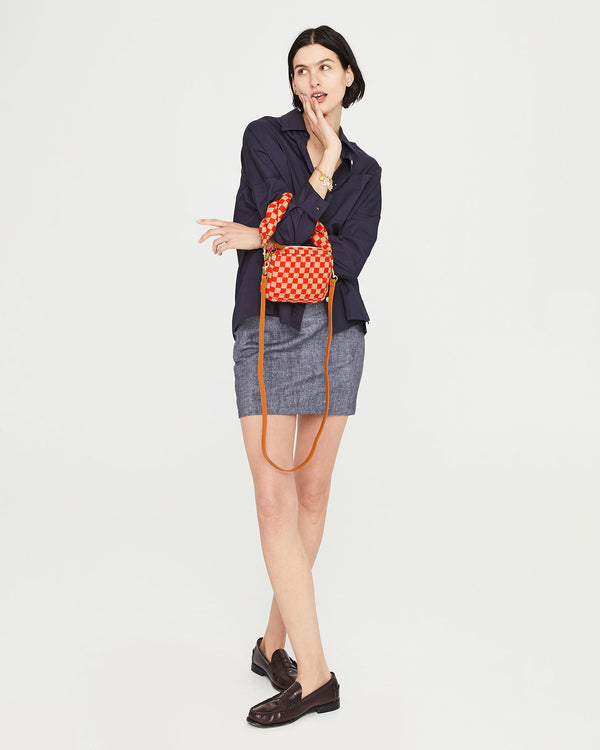 athena with the Poppy & Khaki Quilted Checker Lucie on the crook of her elbow